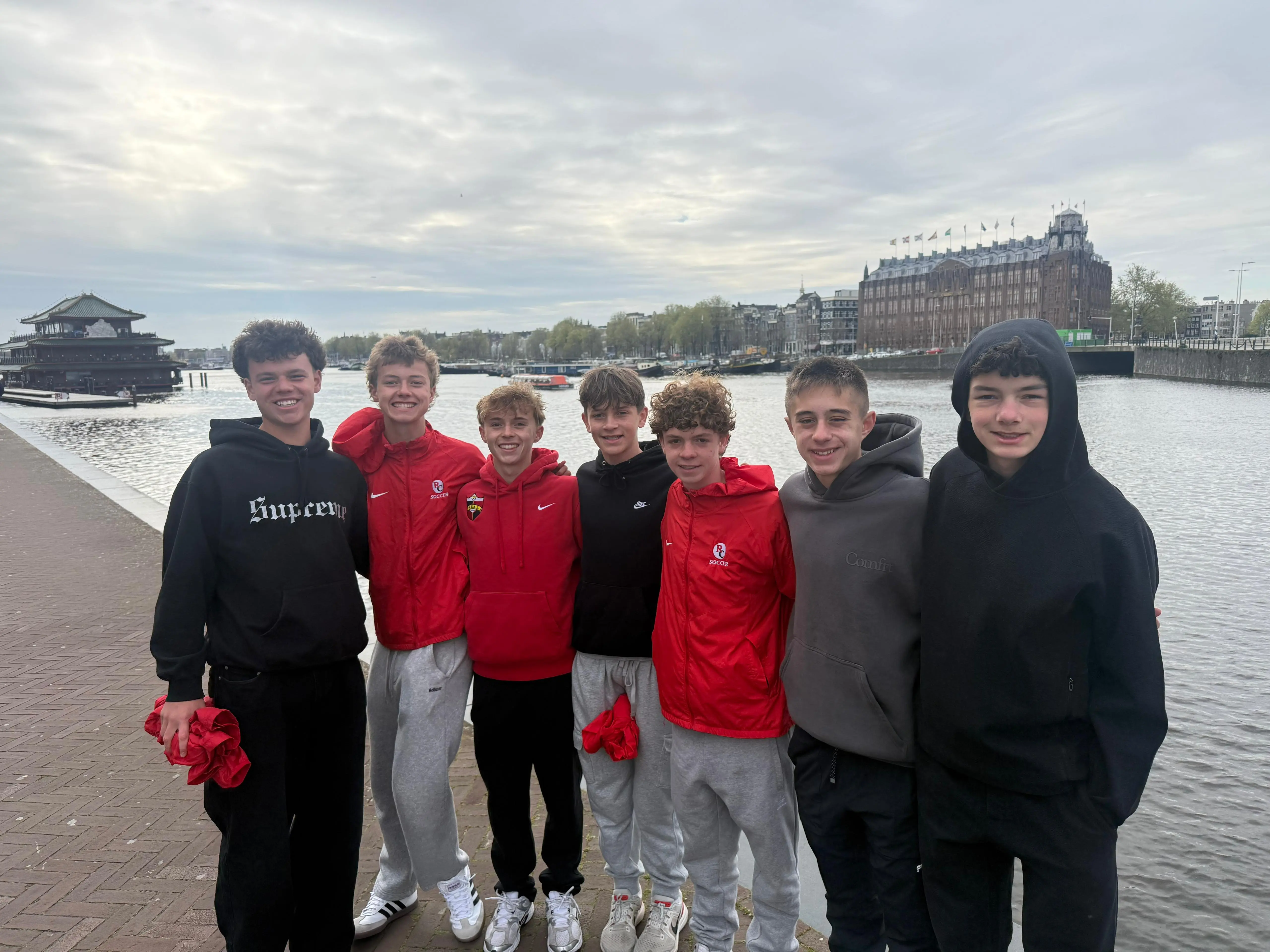 Daylen Hammon and Real Colorado teammates in red jackets along the Amsterdam canal waterfront 2026